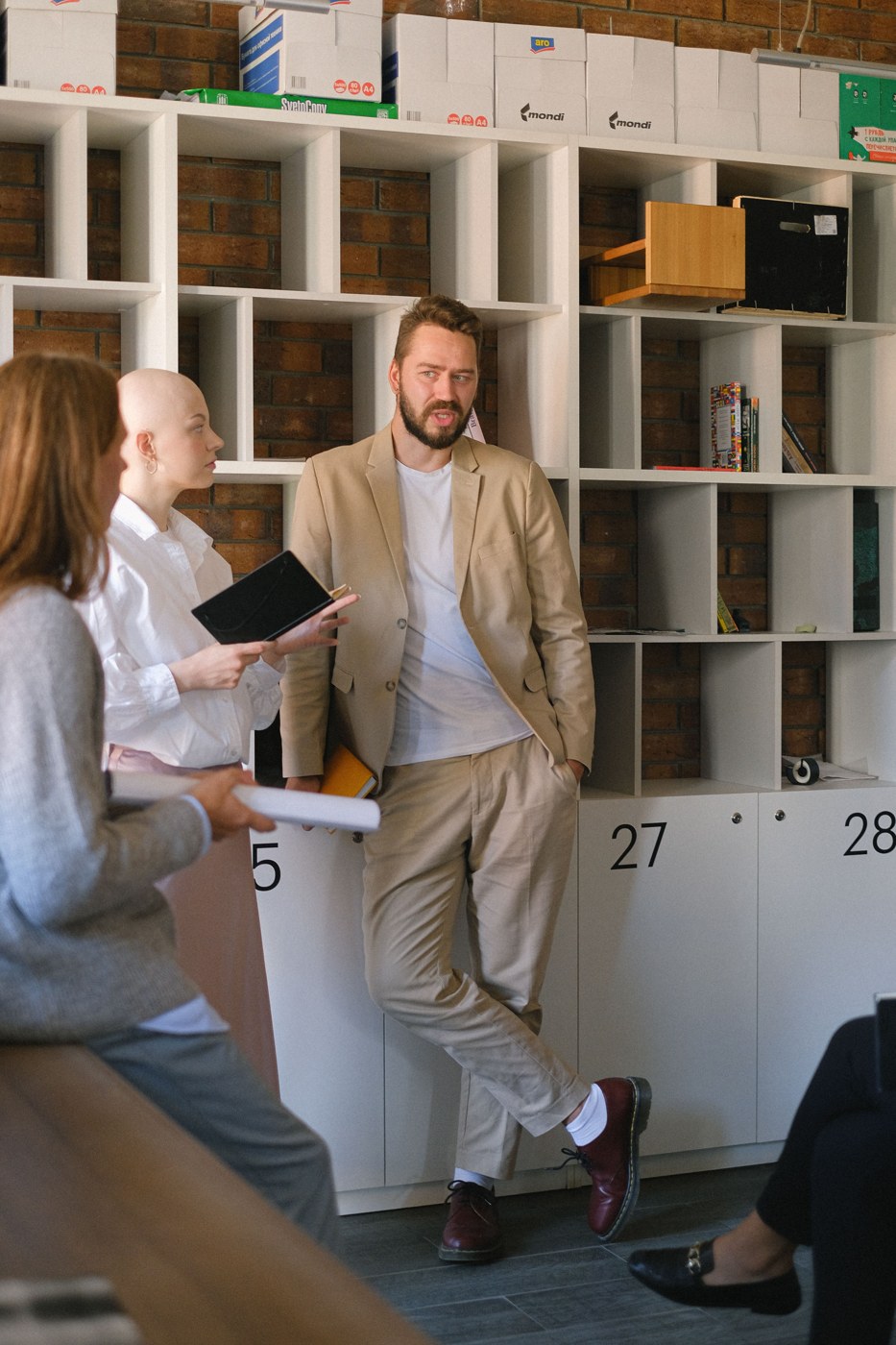 Professionals discussing a business question in an office